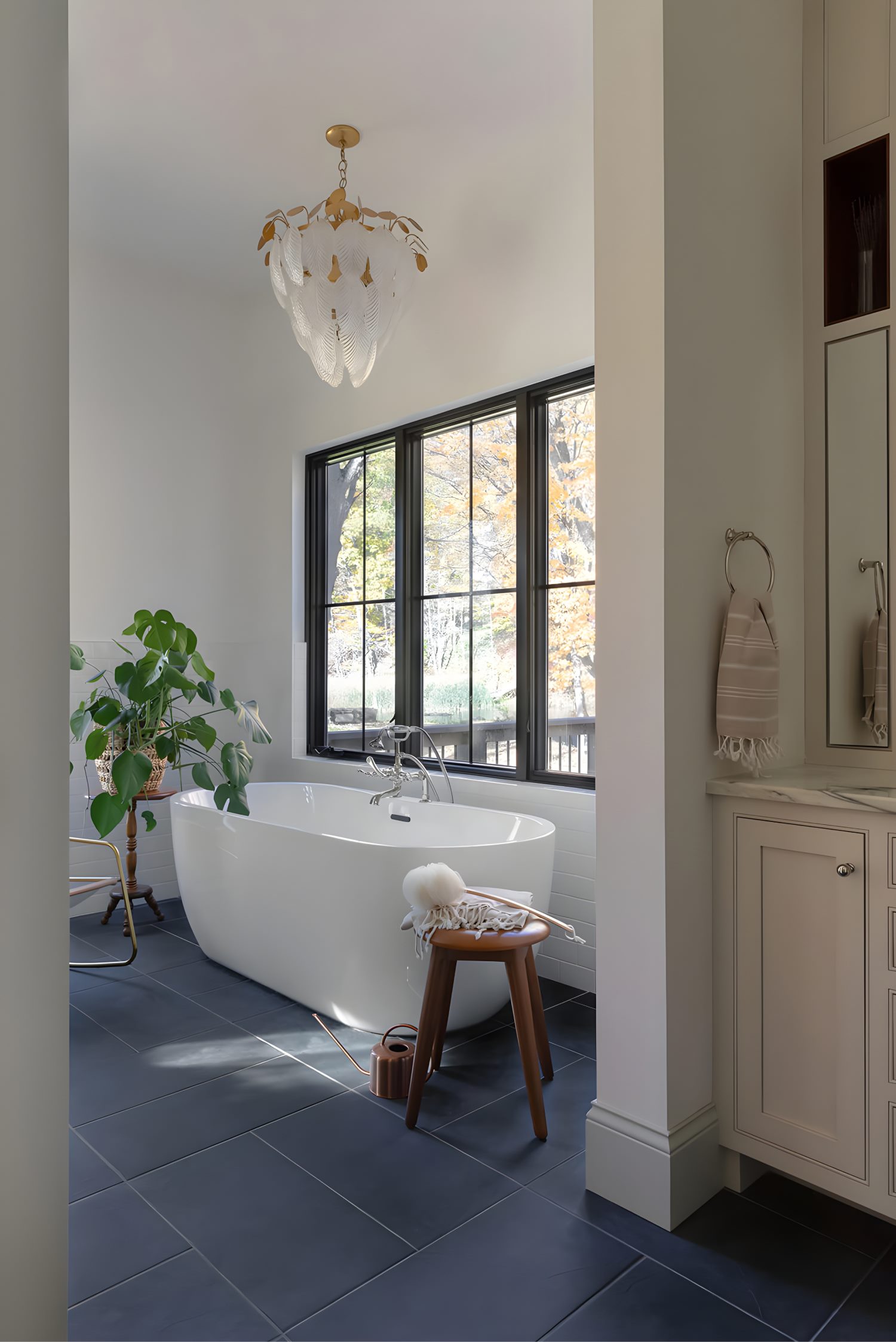 Modern bathroom vanity with double sinks, large framed mirror, and sleek cabinetry in a clean, neutral design.