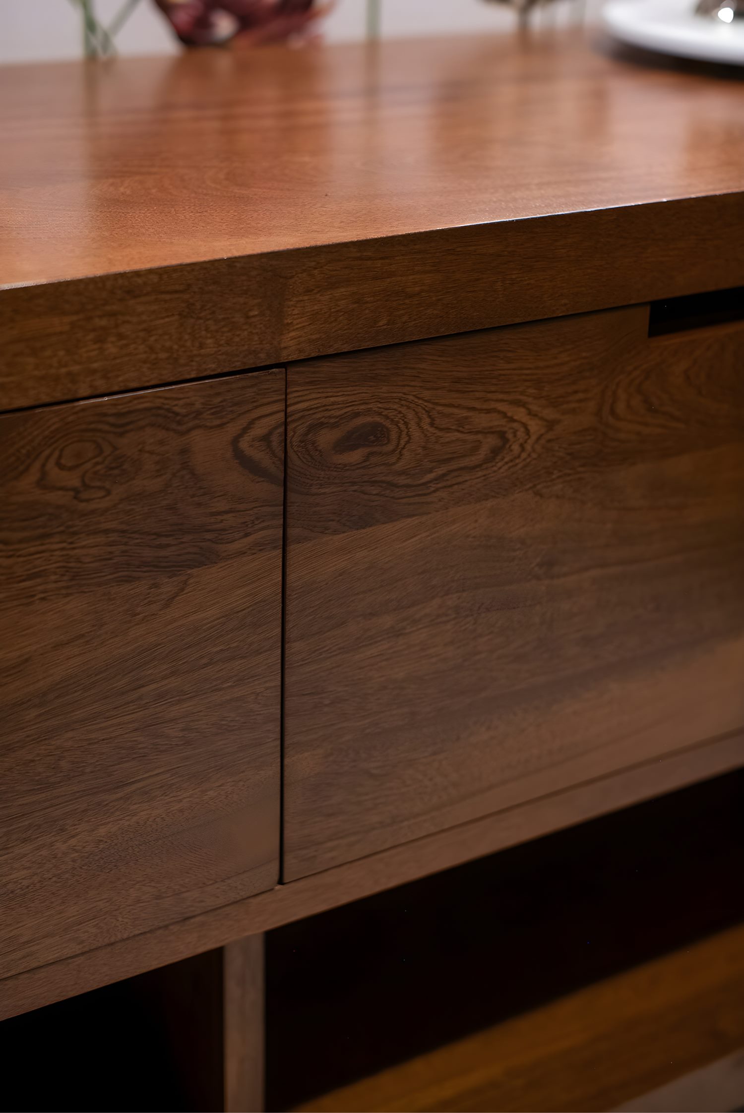 Close-up of wooden vanity surface showing rich grain and natural texture in a modern bathroom.