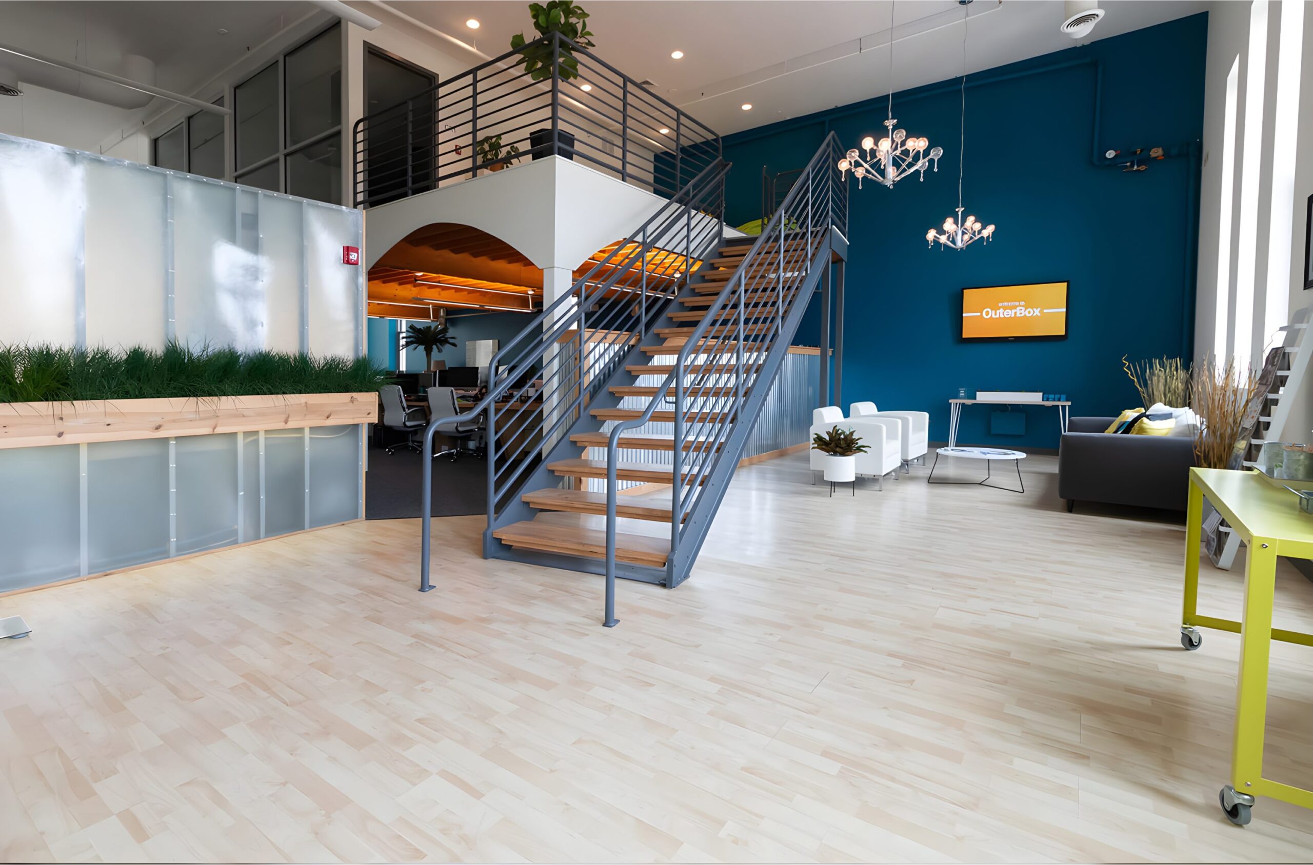 Elegant lobby with high ceilings, marble floor, modern seating, and natural light streaming through tall windows.