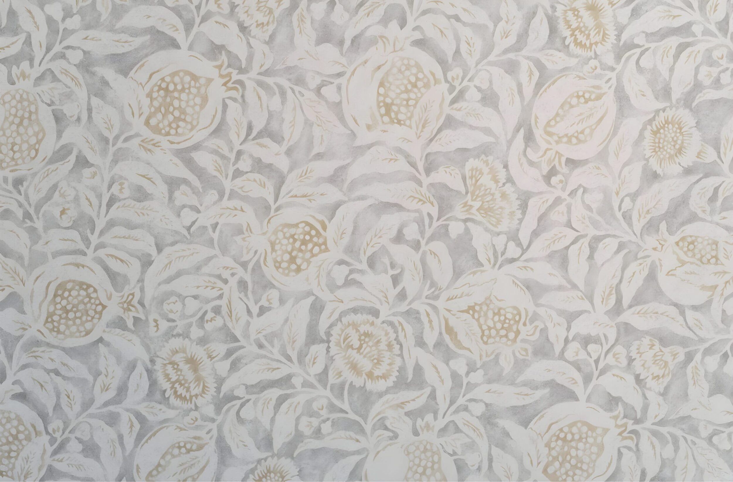 Close-up of beige floral wallpaper with pomegranate pattern in muted tones of white, cream, and soft gray