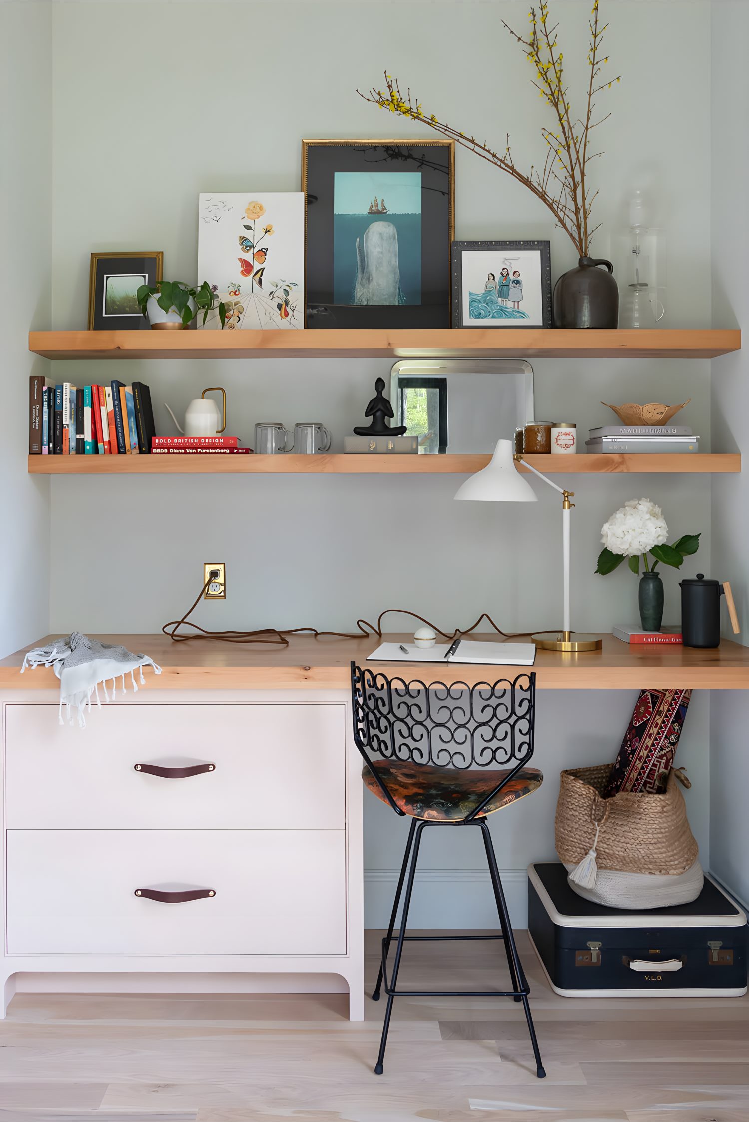 Master bedroom styled with layered bedding, soft textiles, and wood accents creating a warm, inviting atmosphere.
