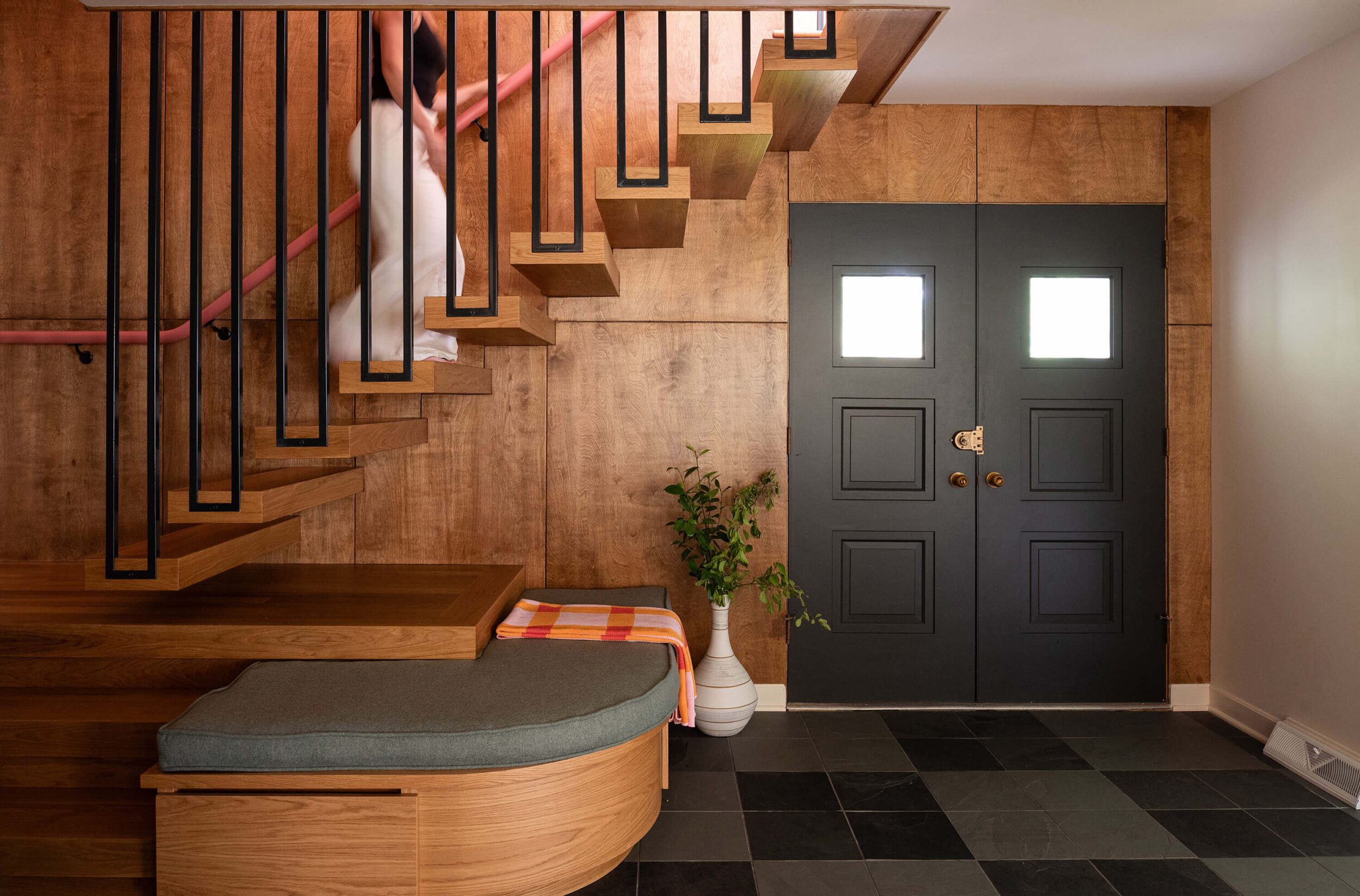 custom entryway cabinetry floating staircase